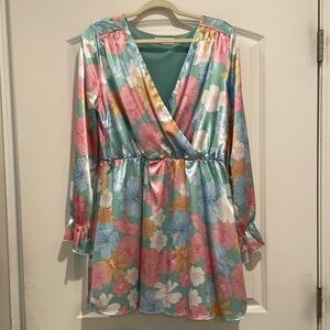 Floral mini dress long sleeves w/elastic waistband. Never worn. Boutique